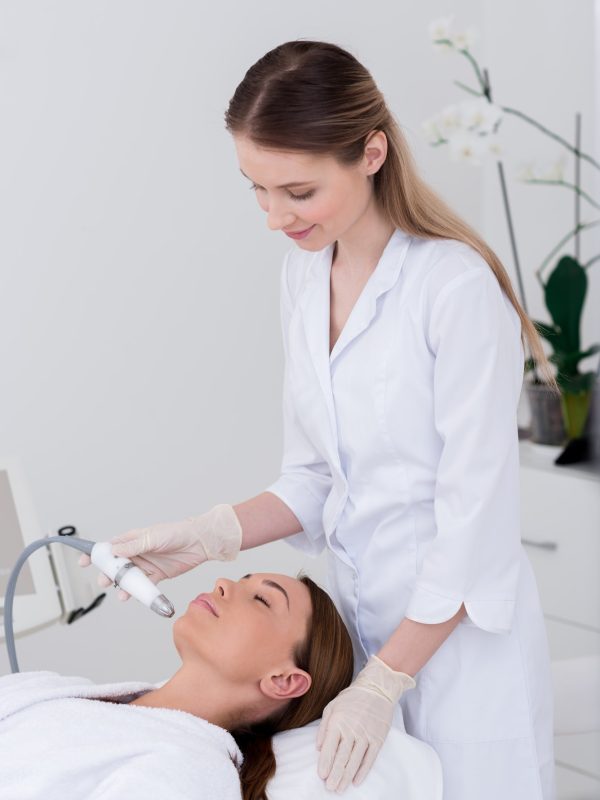 young-woman-getting-facial-treatment-in-cosmetology-salon.jpg